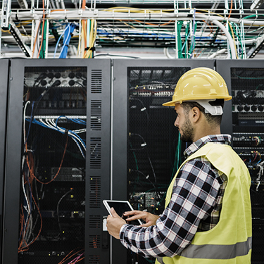 Image of man working on computer network