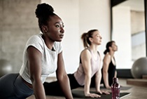 A group of women practicing yoga